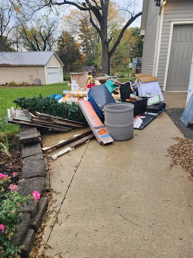 Dumpster being loaded with debris for 3 Yard Dumpster Rental in Florence
